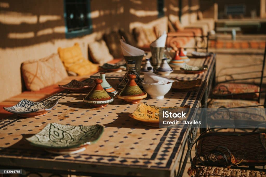 Two business partners shaking hands over a partnership agreement